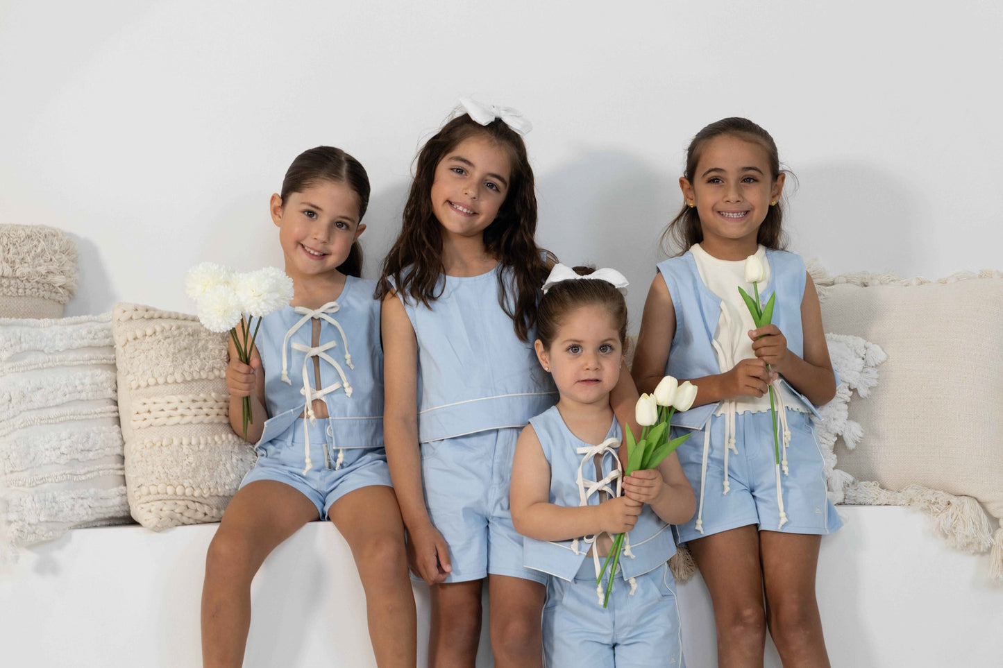 4 model toddler girls in different ages show casing the different ways to style the Alice Set