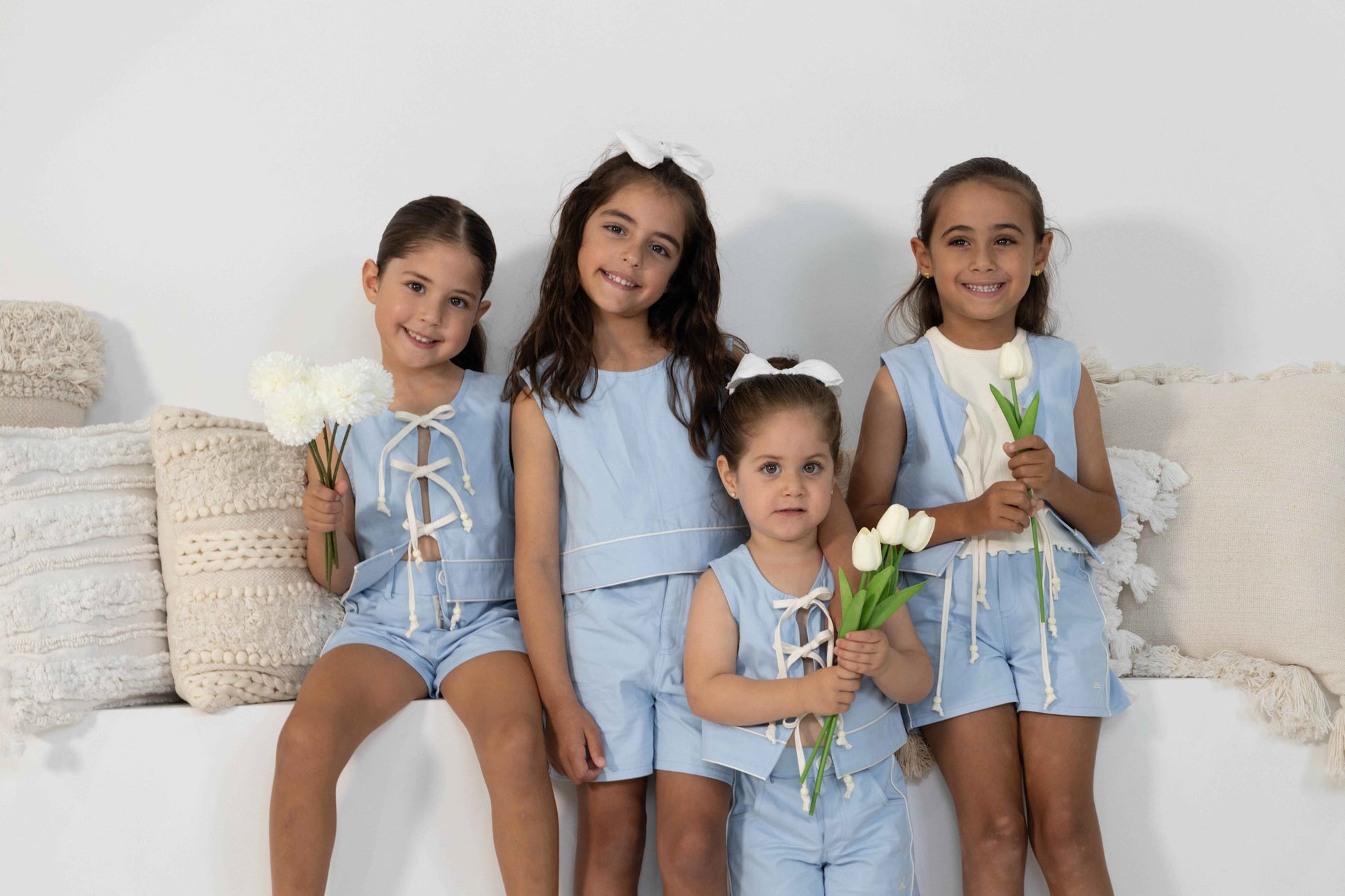 4 model toddler girls in different ages show casing the different ways to style the Alice Set