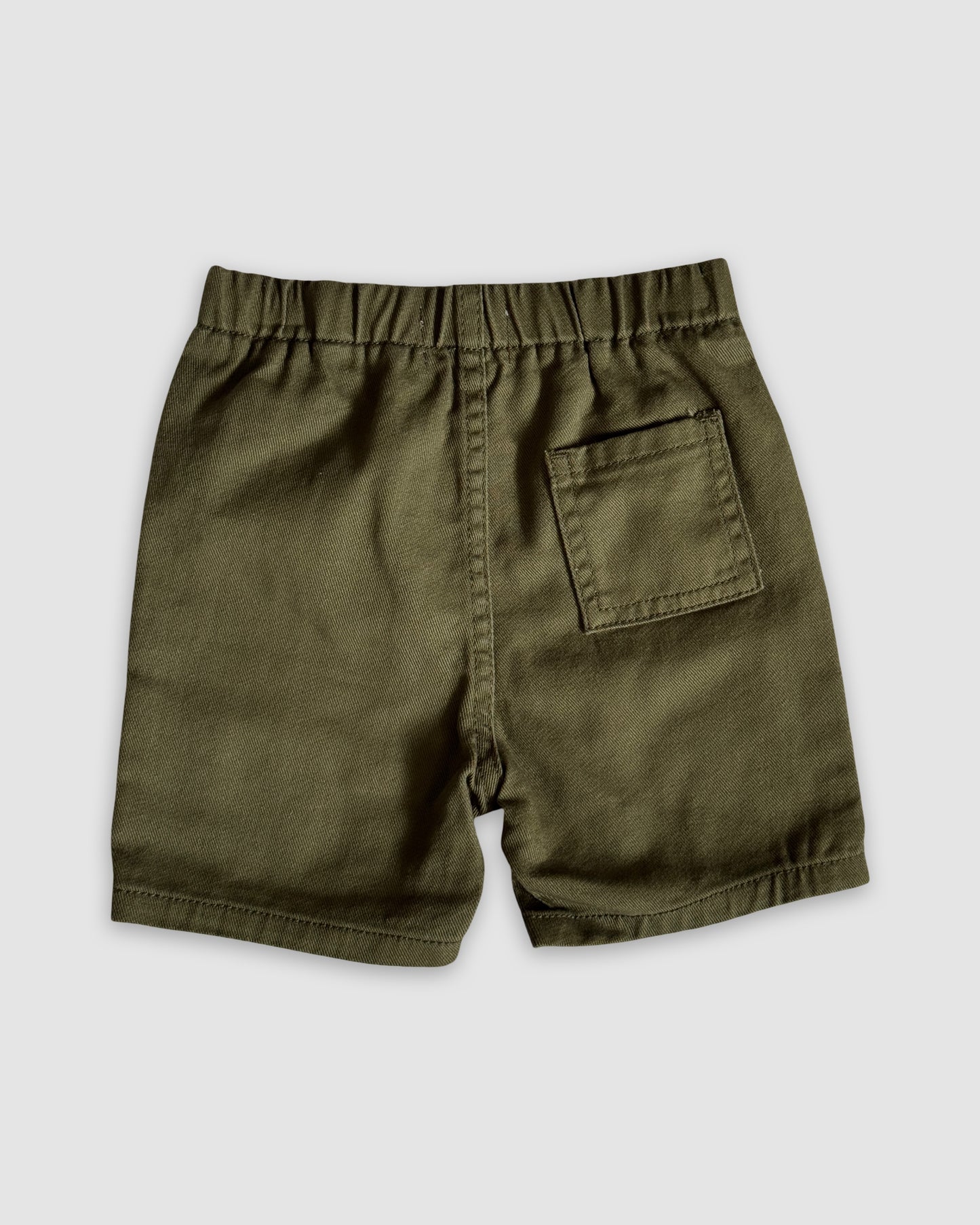 Khaki Green shorts with a pocket on a light gray background