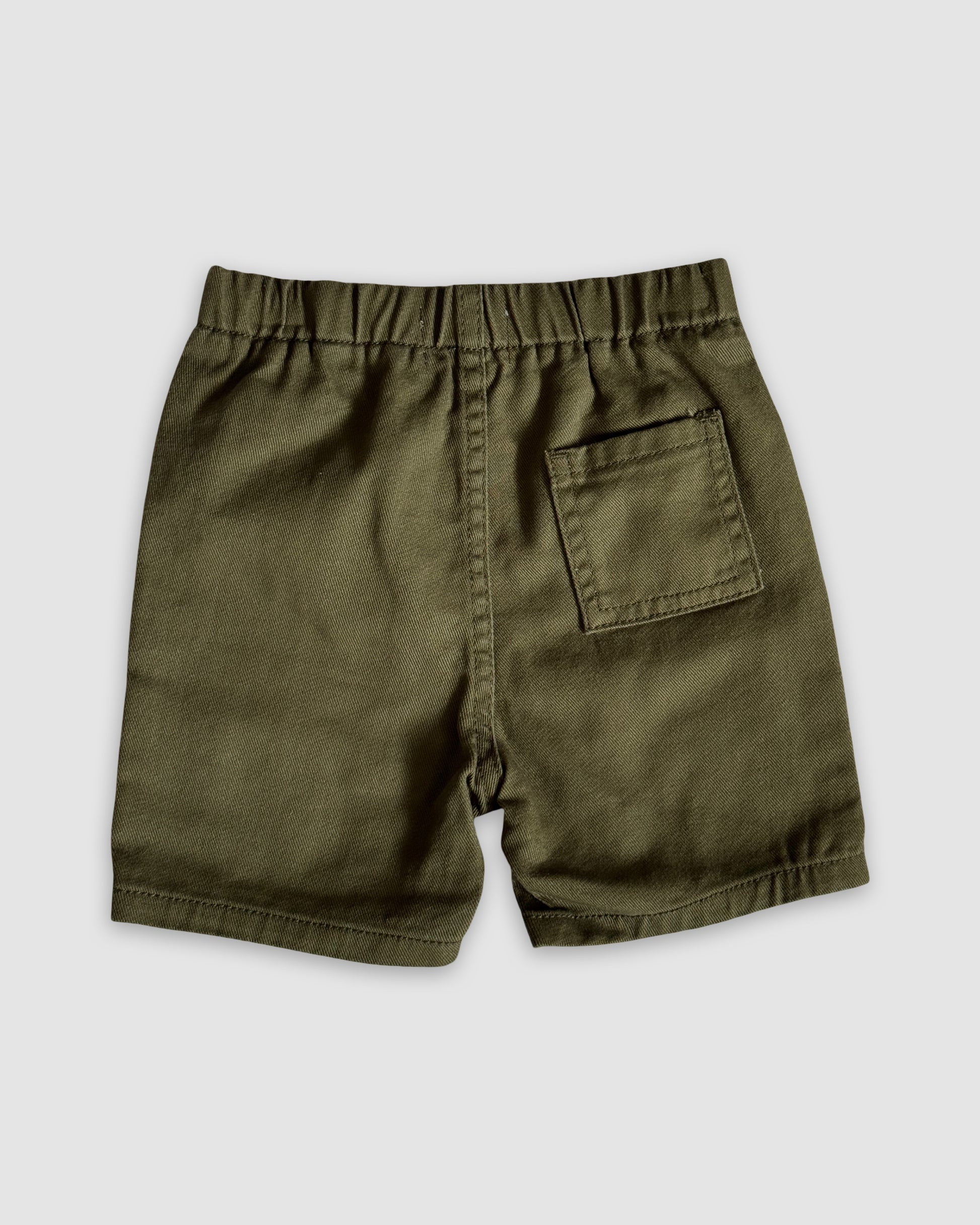Khaki Green shorts with a pocket on a light gray background