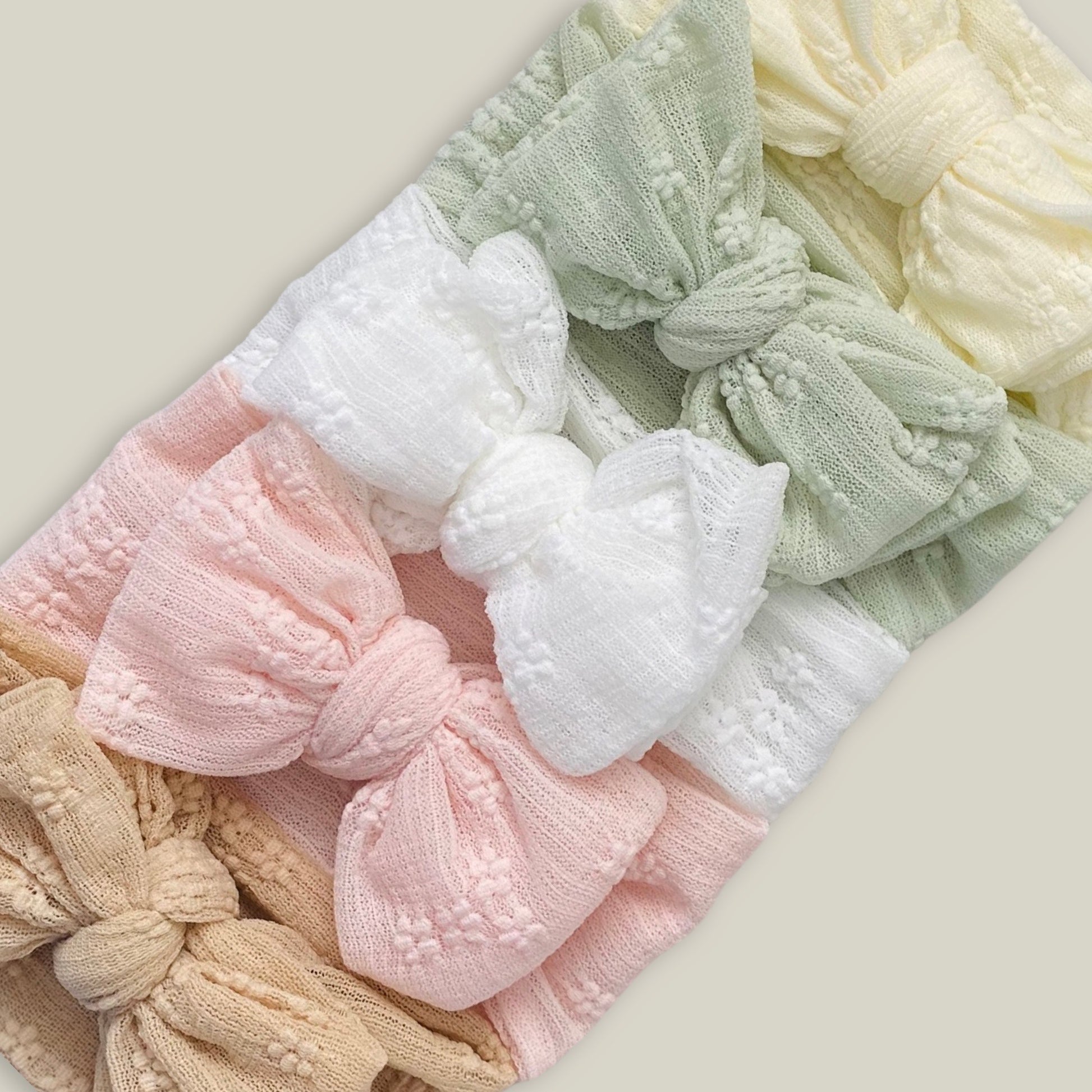 5 different colours of our embroidered lace headbands