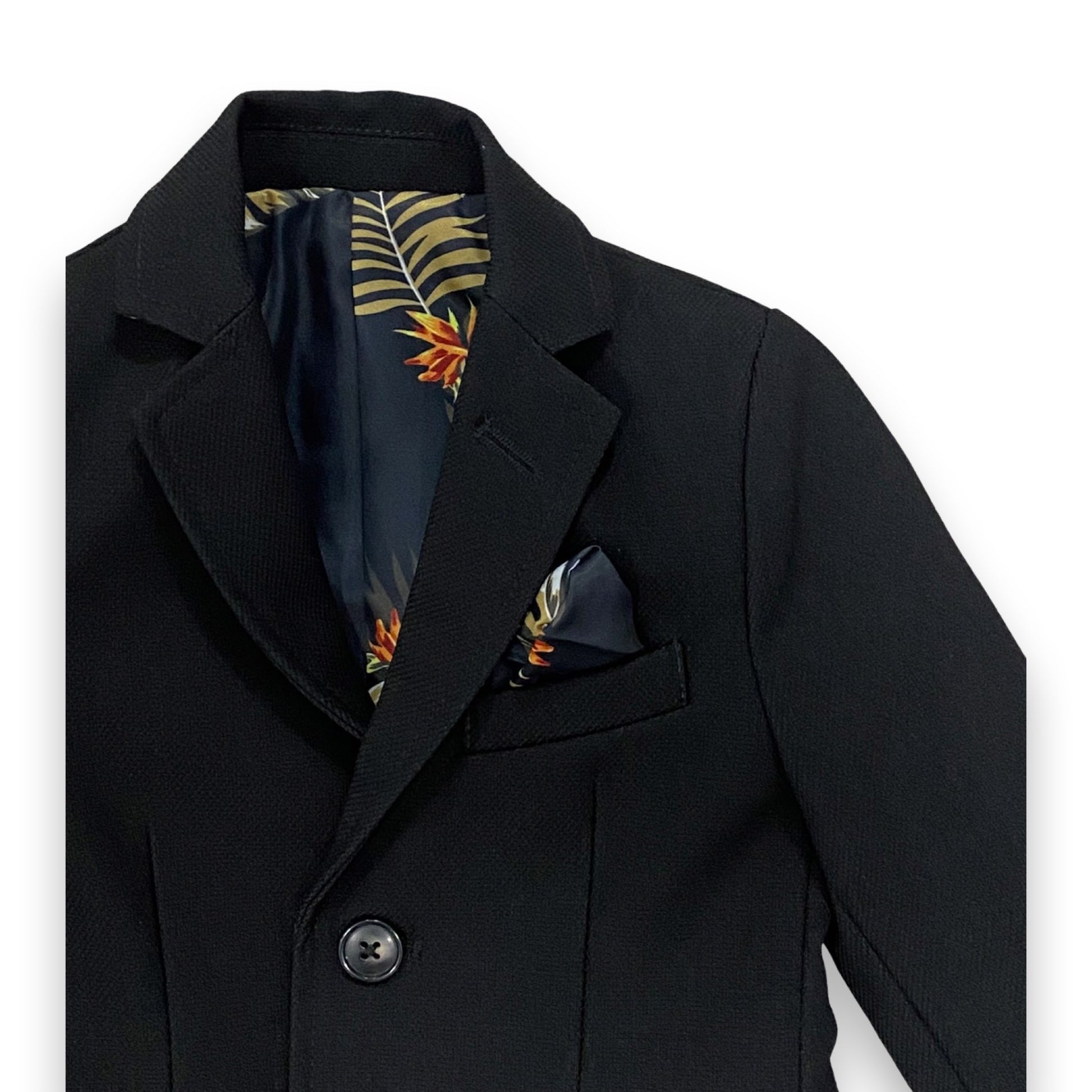 Black coat with a floral pocket square on a white background